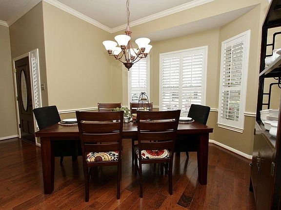 The beautiful windows bay out and enjoy the front landscaped views.