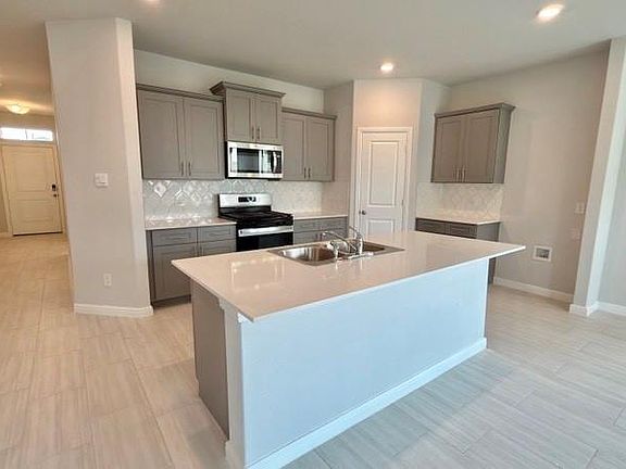Kitchen - All Home and community information, including pricing, included features, terms, availability and amenities, are subject to change at any time without notice or obligation. All Drawings, pictures, photographs, video, square footages, floor plans, elevations, features, colors and sizes are approximate for illustration purposes only and will vary from the homes as built.