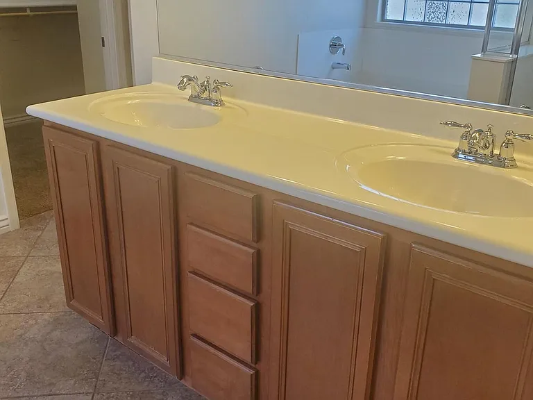 DUAL SINKS IN PRIMARY BATHROOM.