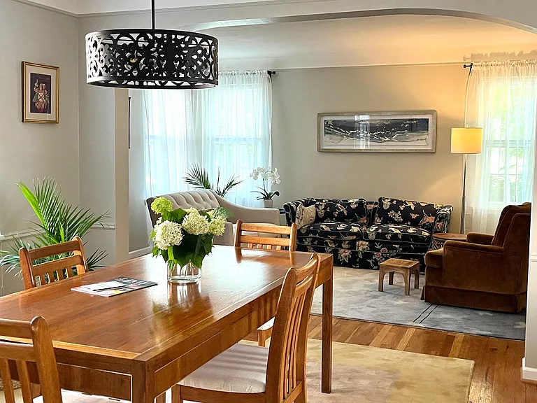 Dining room with table open to living room.
