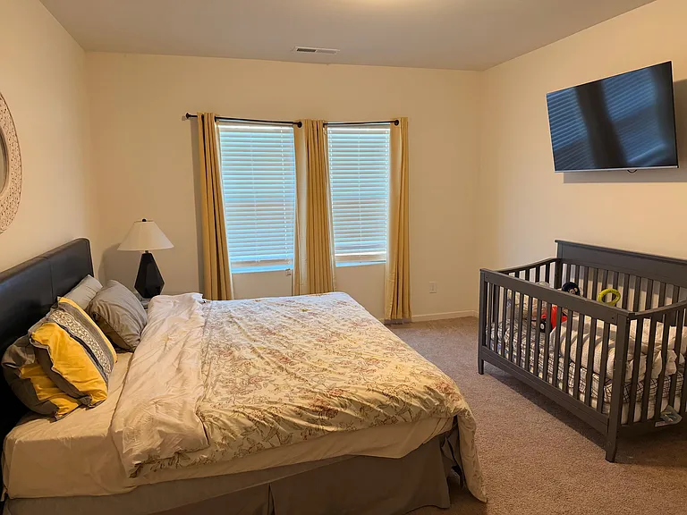 Master Bedroom with King Size Bed, walking closet, and a Flat Screen TV