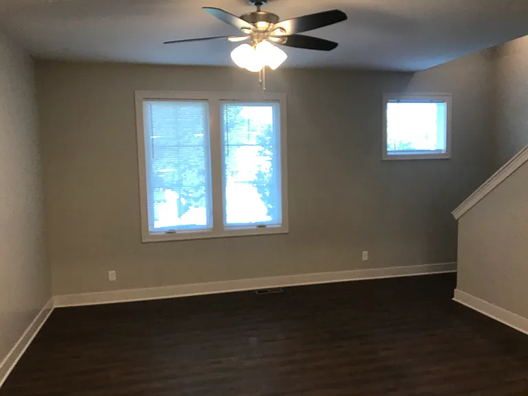 Living room. Stairs to top floor to the right
