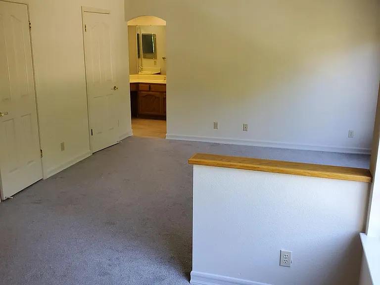 primary bedroom view from fireplace wall