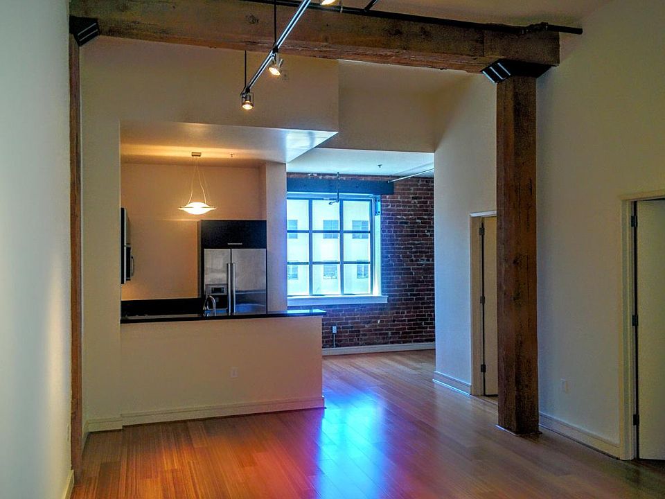 Living room, kitchen and brick