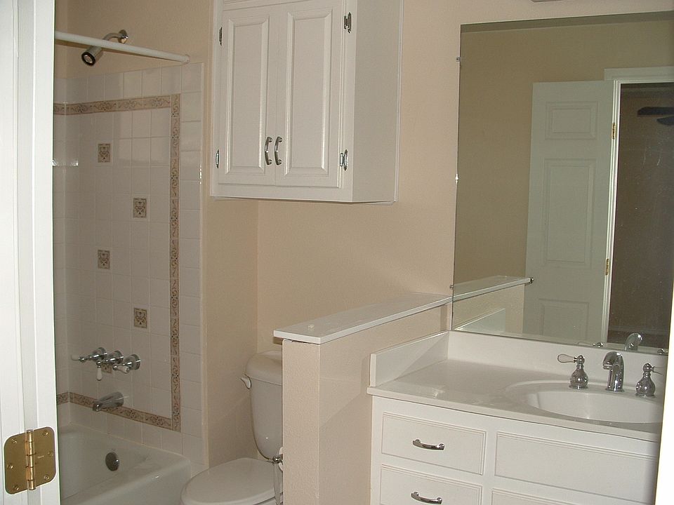 Master bathroom features custom cabinet with drawers, and upgraded fixtures throughout and specialty tile in shower.