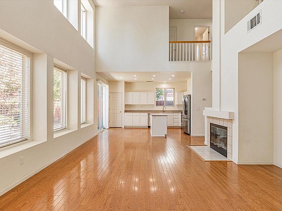 Kitchen next to supersized family room with vaulted ceilings