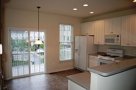Great kitchen with plenty of table space and door to balcony.