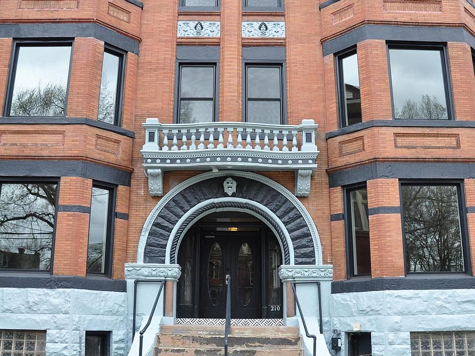 building entrance. Apartment is the 1st floor on the left. Note how far back from the street and raise up the building is for excellent privacy.