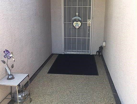 Security Screen Door.  Pebble stone courtyard.
