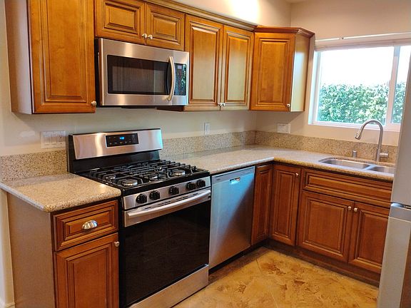 Kitchen comes with 5 burner gas stove, microwave, Dishwasher, garbage disposal and Fridge.