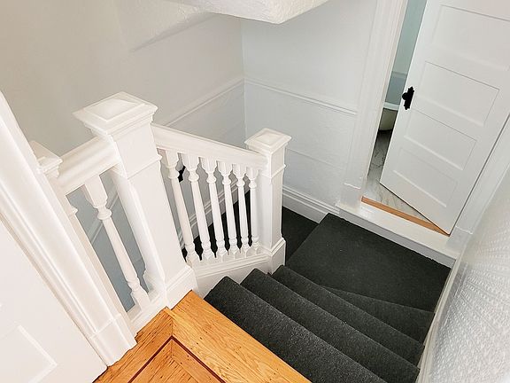 Bathroom halfway up the stairs leading to hallway