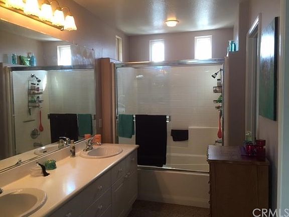 Master bath with dual sinks, walk-in closet and toilet room.
