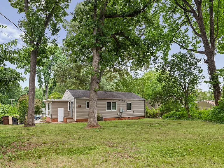 View of back of house, home also offers exterior storage closet.