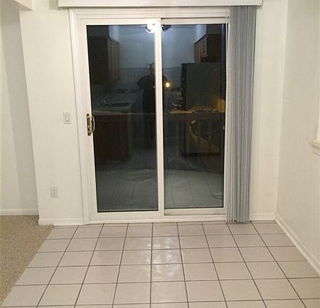 Dining Room w/ Doorwall to Balcony