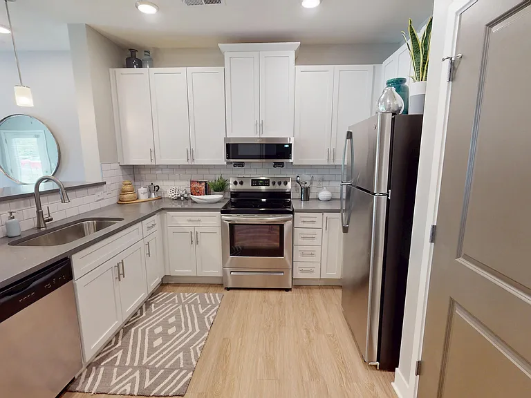 The Conner kitchen includes ample storage space and stainless steel appliances, including a dishwasher, glass-top stove, and built-in microwave. The Conner kitchen includes ample storage space and stainless steel appliances, including a dishwasher, glass-
