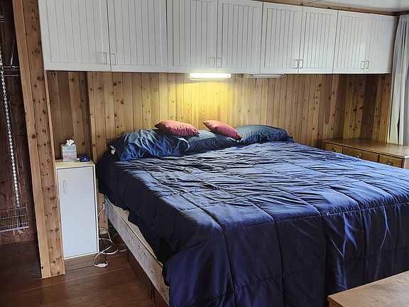 California king bed, overhead storage