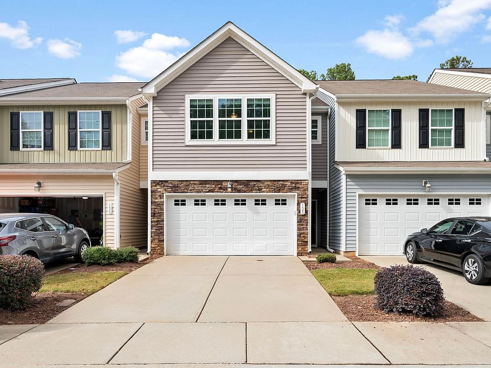 128 Cobalt Creek Way, Holly Springs, NC 27540 with a 2 car garage for plenty of storage space. Includes over head storage racks.