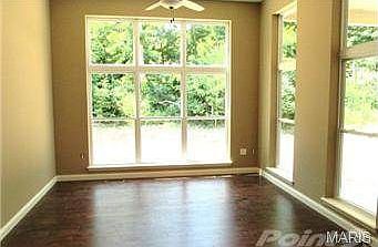 HEARTH RM/ SUNROOM W/ BIRCH PLANK WOOD FLOORING