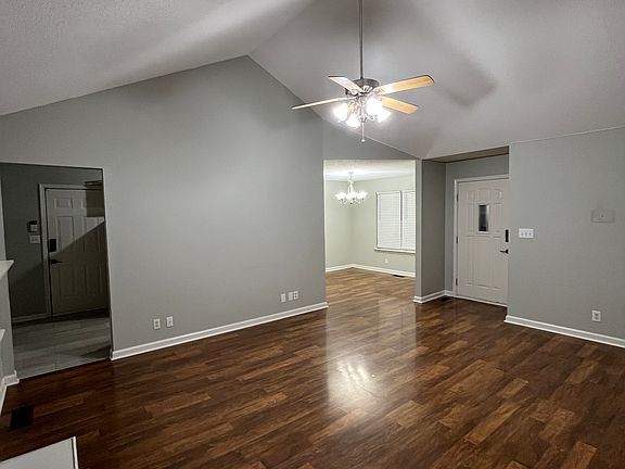Large living room with direct access to dining room and kitchen.