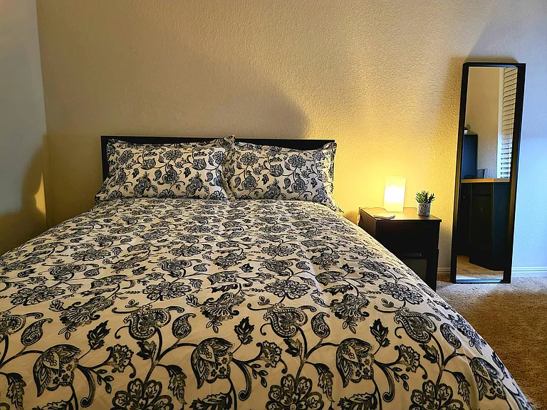 Bedroom #3 located in the second floor. Furniture includes a full size (double bed), night table and lamp, 4-drawer dresser, full size mirror and a work area (desk, lamp, USB-power strip and chair)