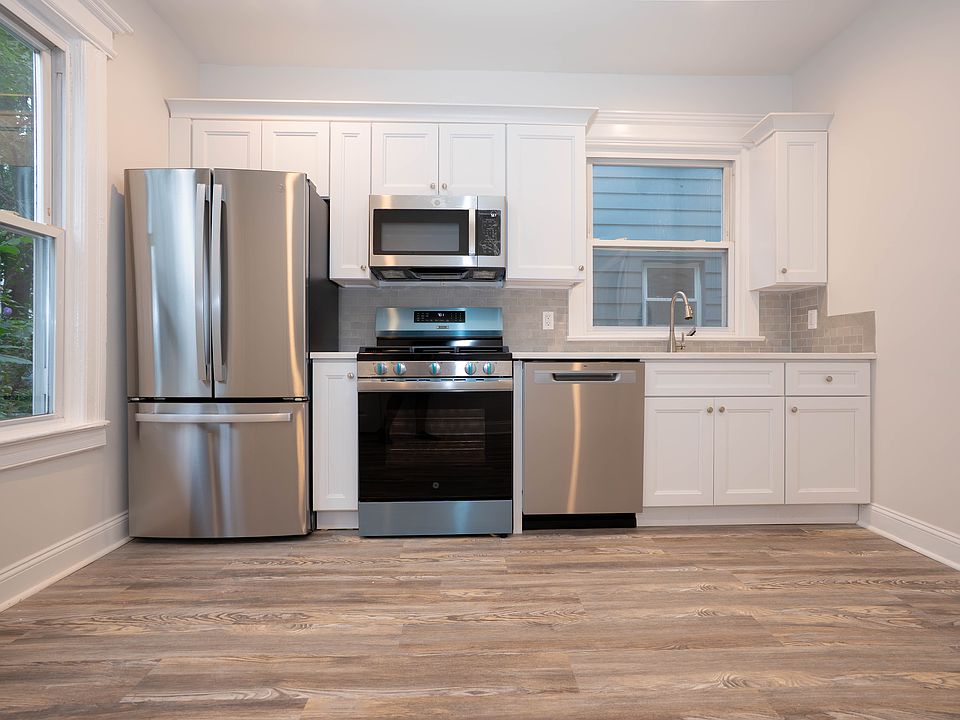 Large, eat-in Kitchen, brand new cabinets, counterop, and full-size appliances..