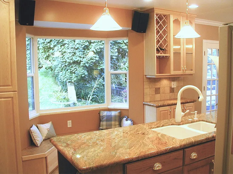 island kitchen with bay window seating nook