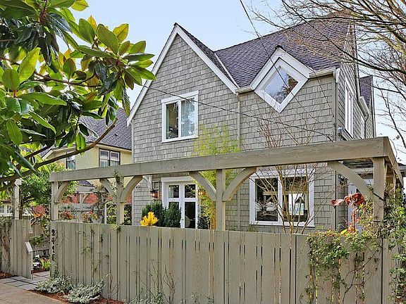 Lovely Cape Cod with tranquil garden spaces and exquisite plantings on a tree lined street. Unusual combination of big views with level, quiet street.