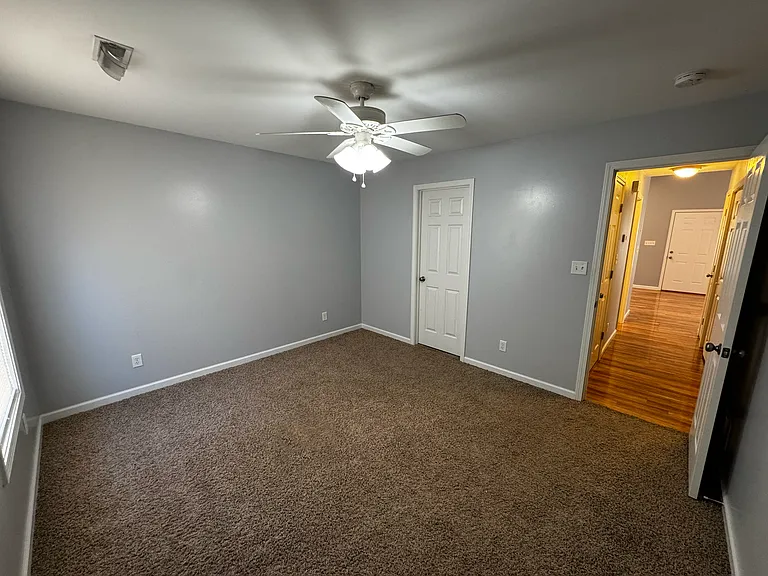 Inside view of the master bedroom with a large walk in closet so you can stock up and store plenty of shoes, clothes and other valuables you want to keep safe in your space.
