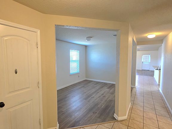 Entrance with an open concept for an office space or second living area or play room, the possibilities are endless!