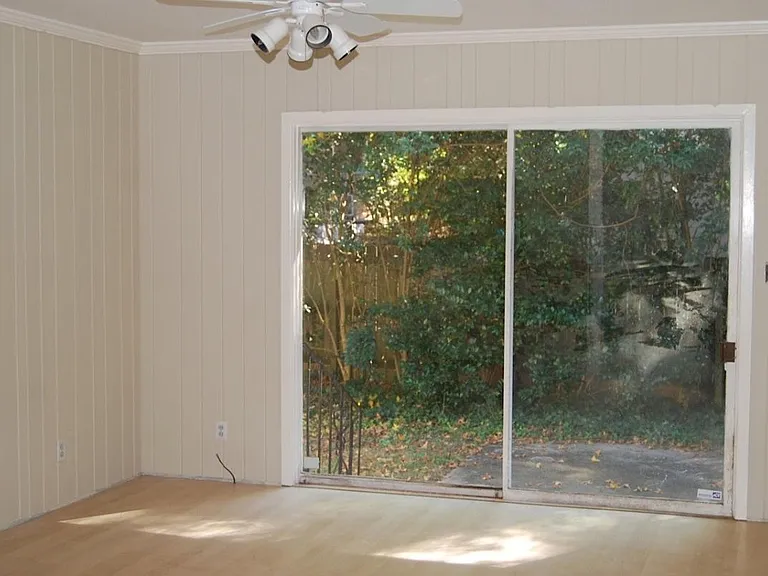 glass doors to fenced back yard, inside are wood floors