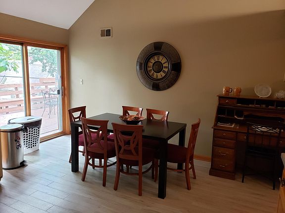 Dining area from other side of kitchen and door to the deck