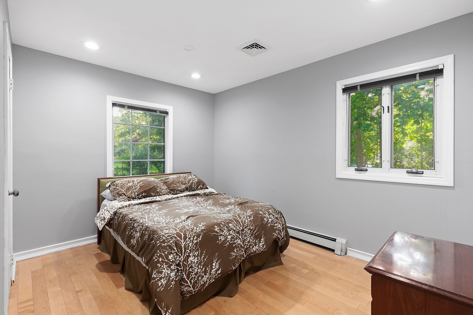  One of the bright guest bedrooms