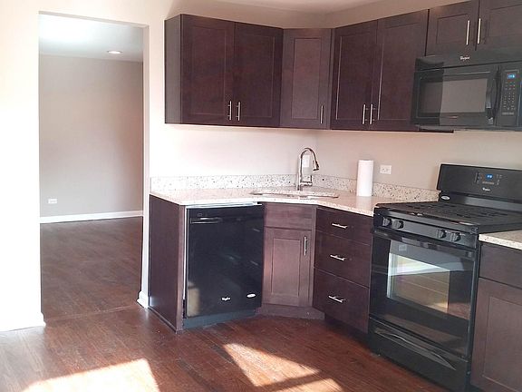 View of the kitchen walking towards the living room.