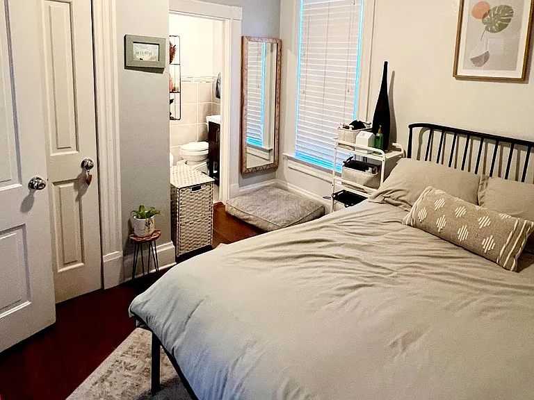 The master bedroom (off the kitchen) with an ensuite bathroom.