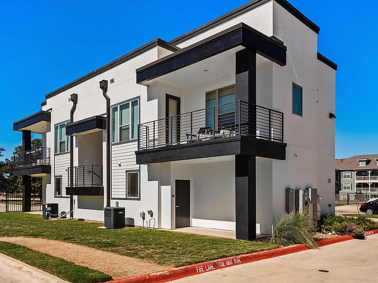 Expansive Outdoor Patios and Bold Black Trim Detailing at Rhythm Apartments