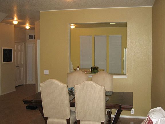 Formal dining room with tile floors and breakfast bar