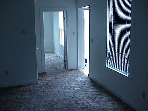 Front entrance which opens into the living room, and downstairs bedroom at the front of the home.