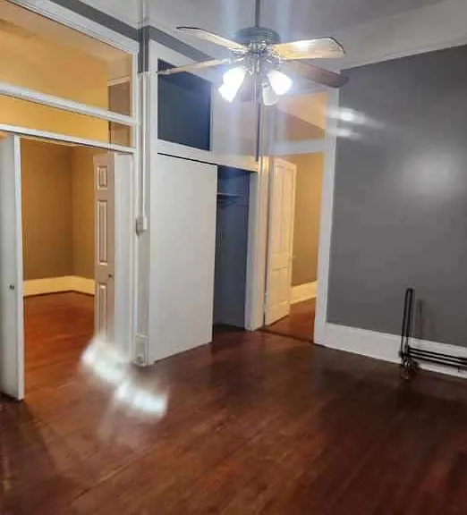 Bedroom 1. Bifold doors are to the living dining room. Large closet. Door connecting to Bedroom 2 if you elect to leave the door open.
