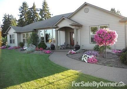 Front of house
						:
						Move in ready, warm earth tones, custom trim, cozy wood stove, oak floors.