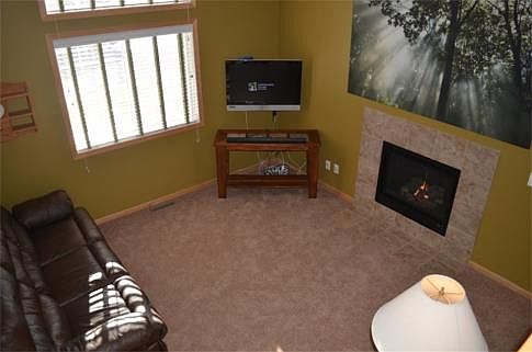Ceramic tile surround on the gas fireplace.