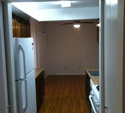 Kitchen overlooking breakfast nook with new lighting fixture
