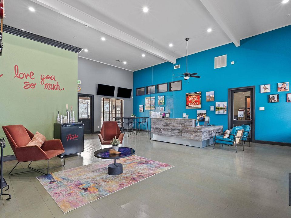 Stylish Community Lounge with Fireplace at Ovation Apartments in Austin, TX