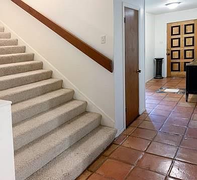 The unique door and inlayed tile in the entryway are a couple of touches that makes this home special.