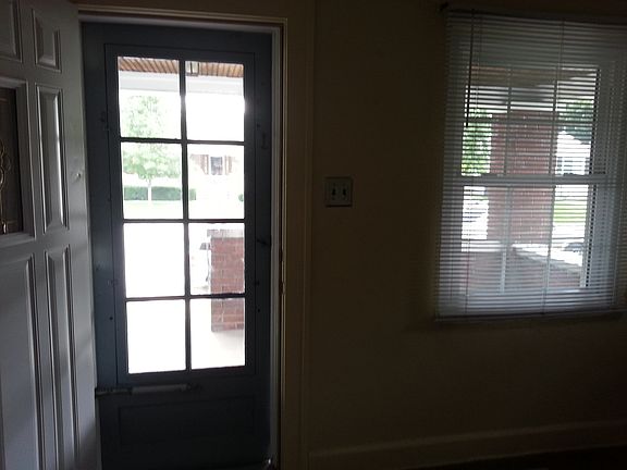 Plenty of light in the living room with covered porch right