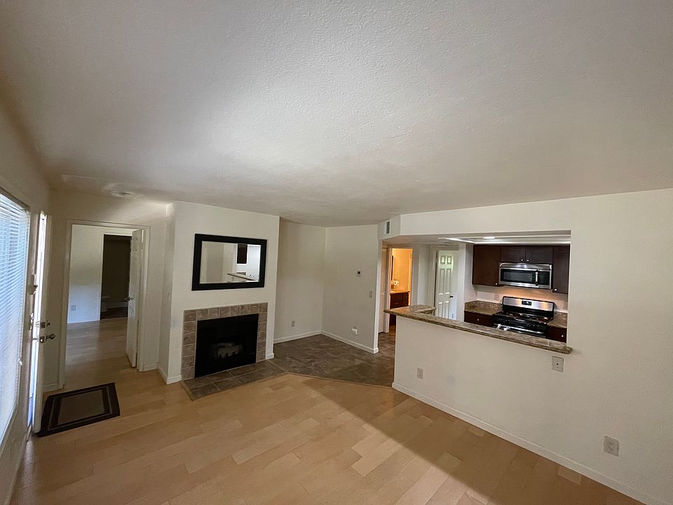 Living room showing pass-through to the kitchen.
