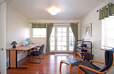 Main floor study opens to brick patio