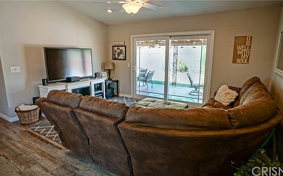 Large living room with slider to the back yard