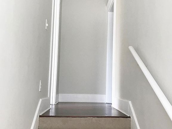 Front stairs landing. Bedroom 1 on right. Hallway entrance to the left.
