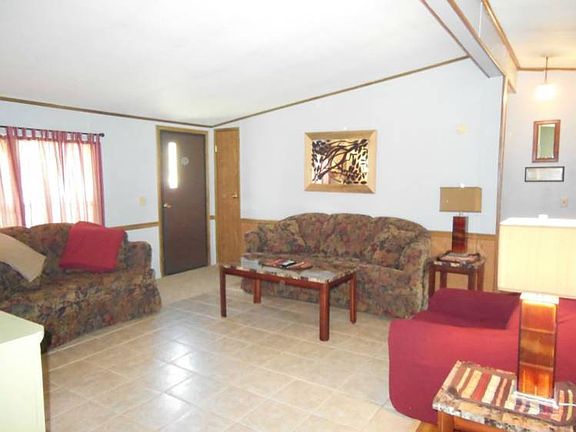 Lovely living room with ceramic floors.