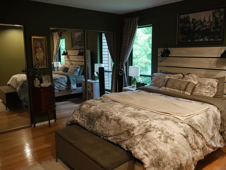 Two huge sliding mirror door closets